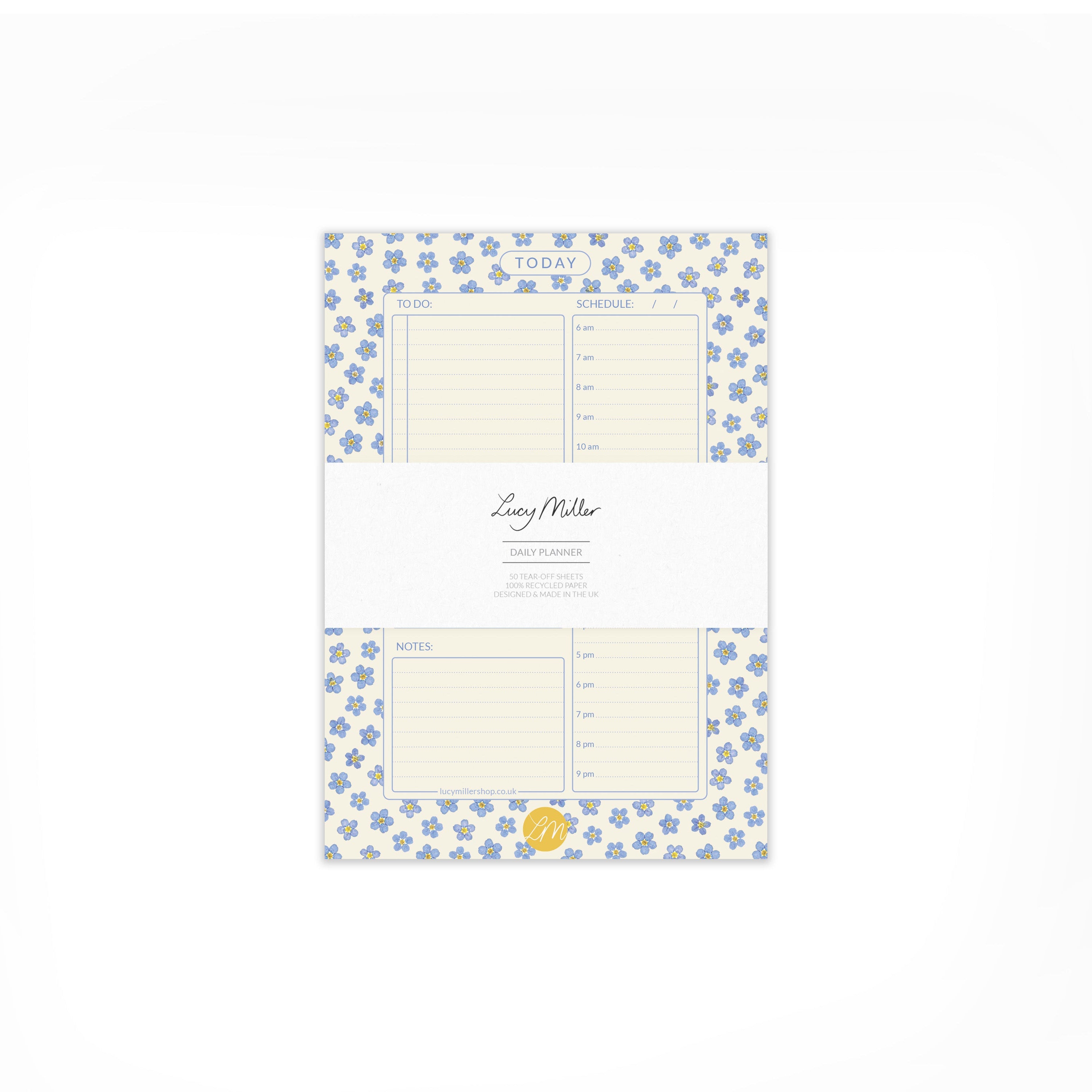 Pressed forget-me-not daily planner pad with branded 'Lucy Miller' belly band, on a white background.
