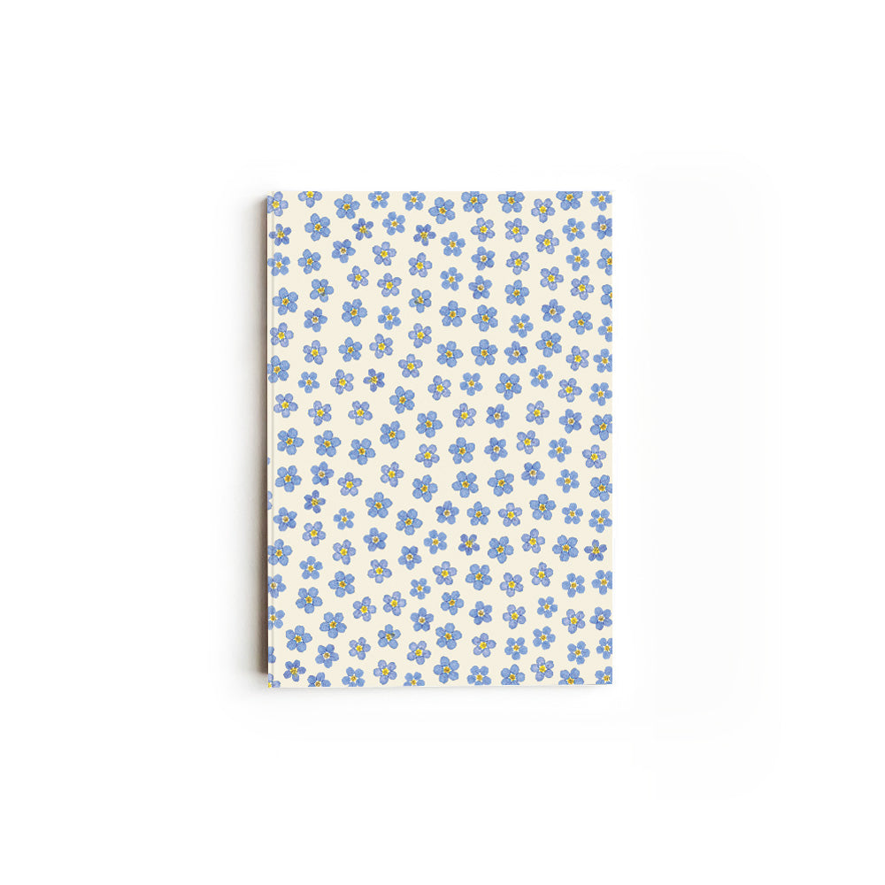 Notebook with pressed forget-me-not floral pattern, on a white background