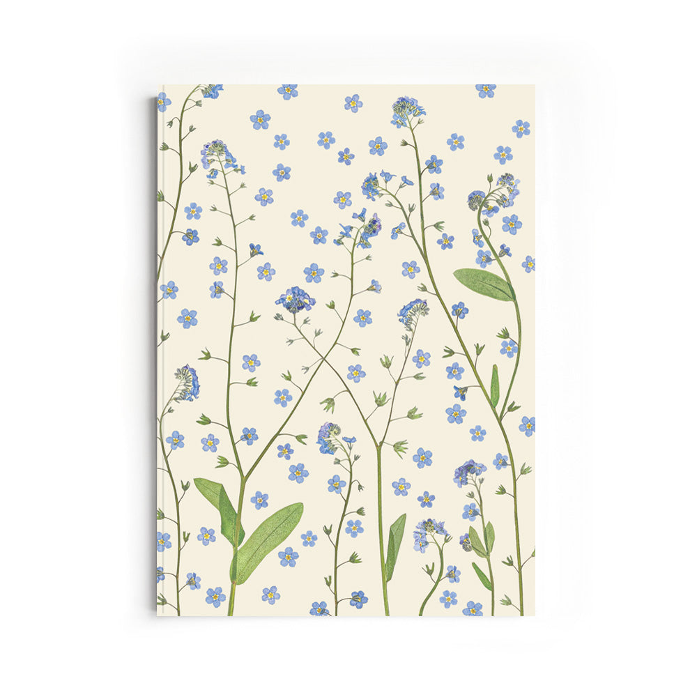 Notebook with pressed forget-me-not floral design on a white background