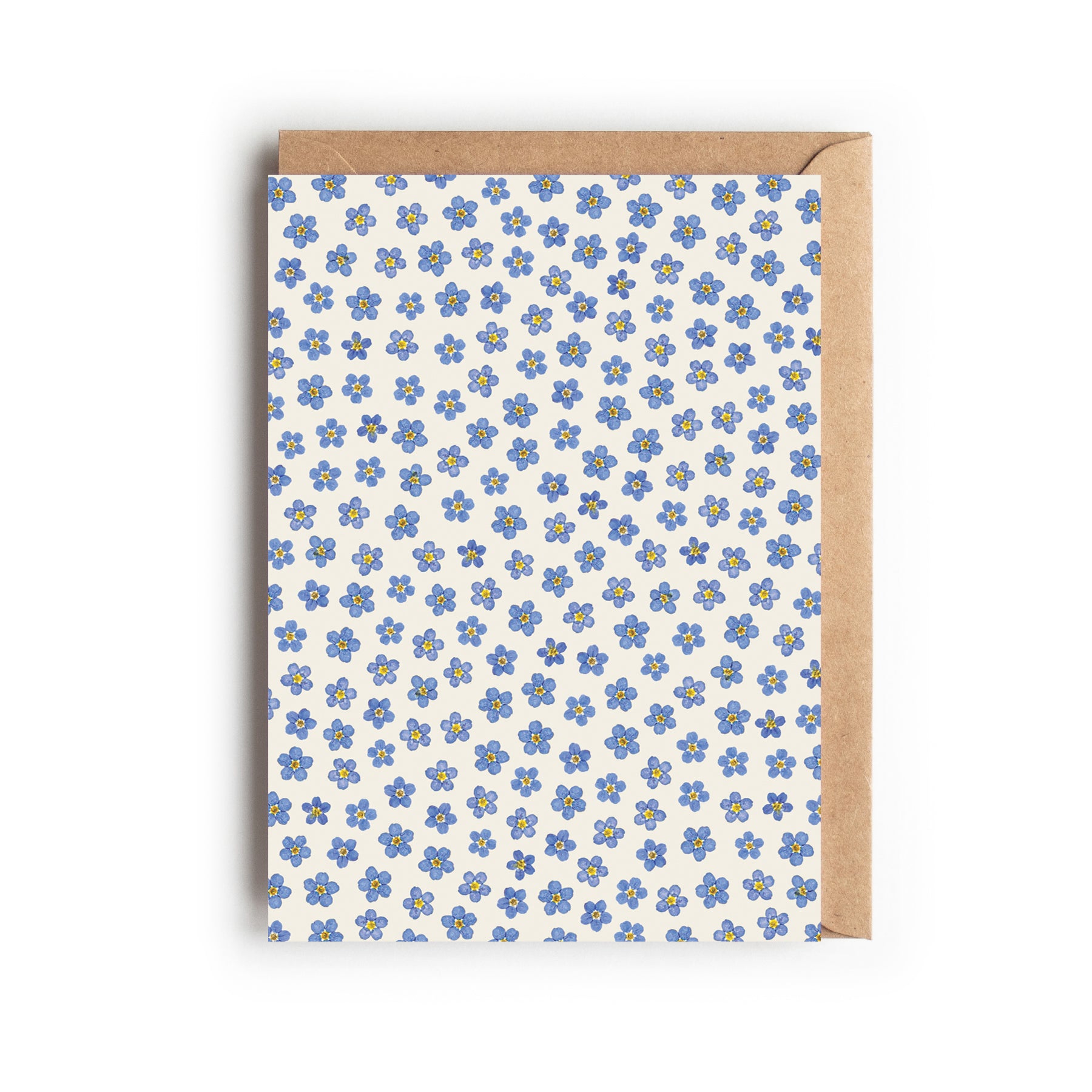 Greetings card with a pressed forget-me-not flower head pattern, on an off- white background. Designed and made in the UK.